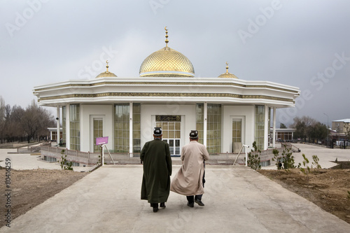 Muslims go to pray in the Mosque Nur ul Islam in Khujand photo