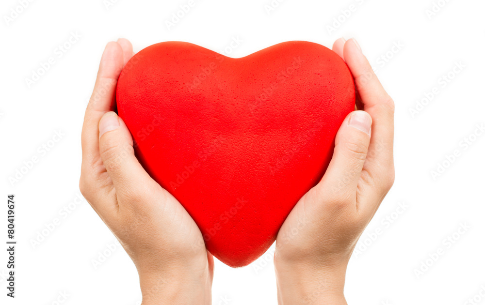 Red heart in man hands, isolated on white Red heart in man hands, isolated on white
