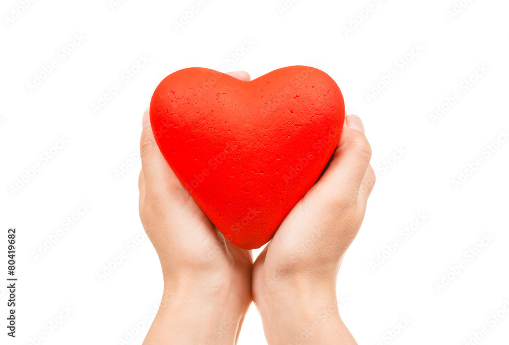 Red heart in man hands, isolated on white Red heart in man hands, isolated on white