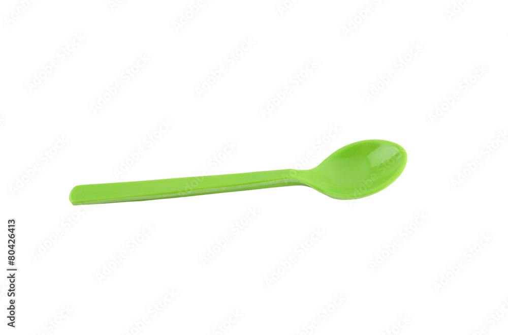 Green plastic spoon isolated on white. Green plastic spoon isolated on white.