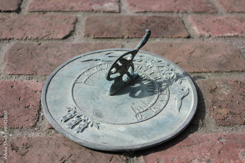 Sundial on brick