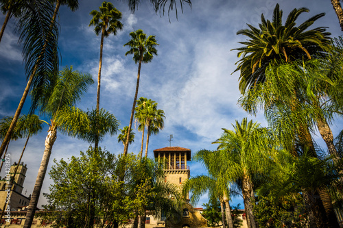 Palm trees and the exterior of the Mission Inn  in Riverside  Ca