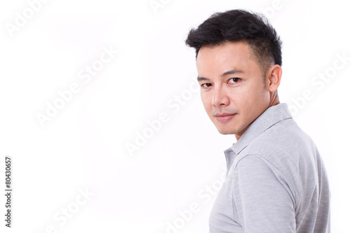 portrait of asian man looking over his shoulder
