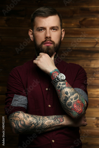 Handsome man with tattoos photo