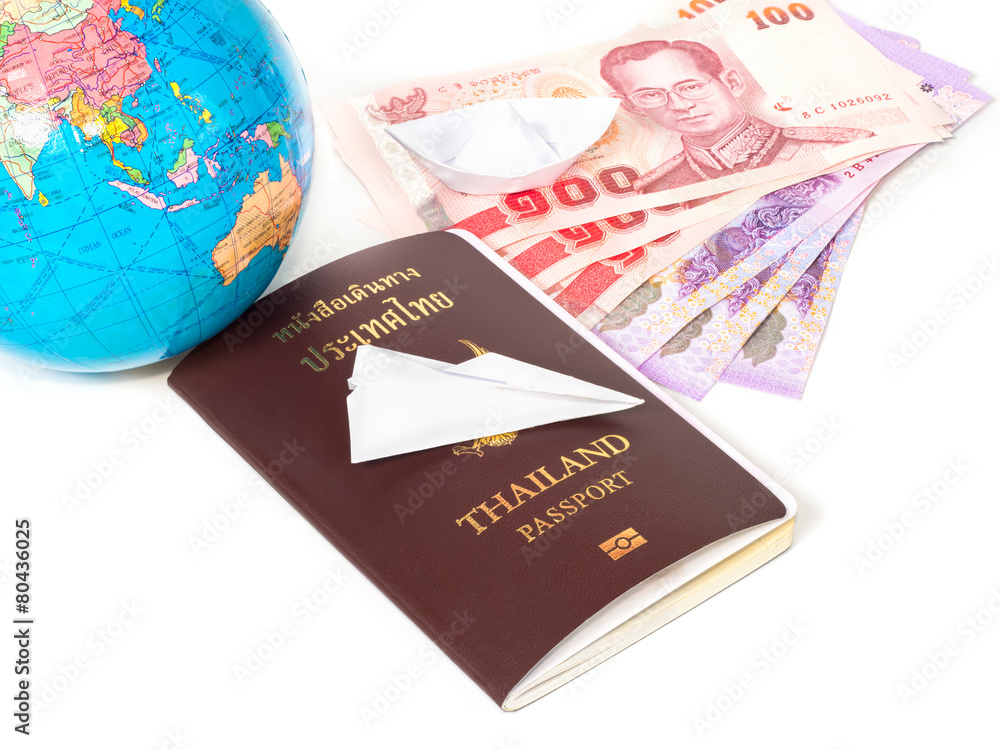 Close up traveling documents passport,globe and origami paper p Close up traveling documents passport,globe and origami paper p