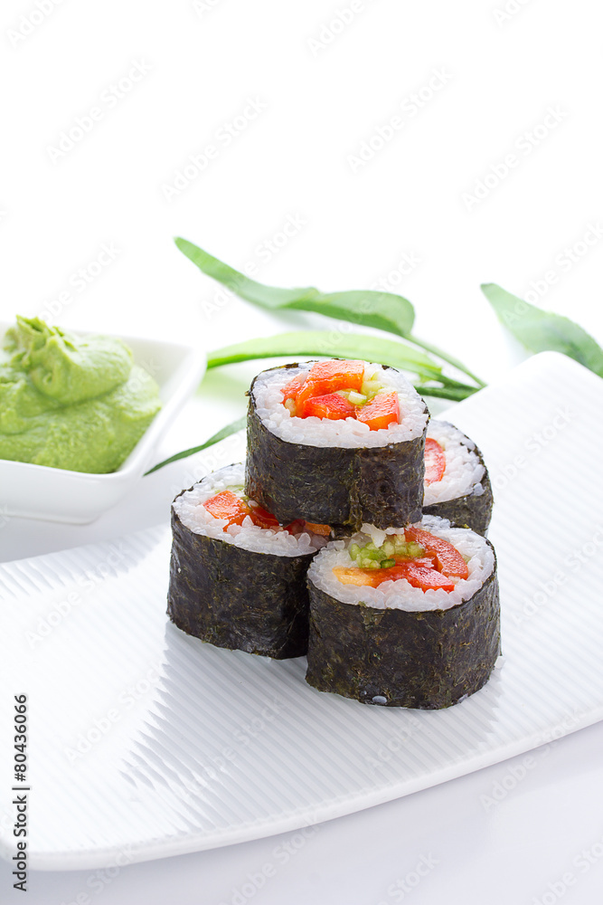 Sushi maki on white plate over white background Sushi maki on white plate over white background