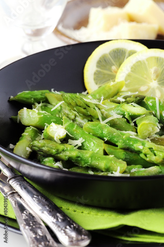 Freshly cooked green asparagus with parmesan