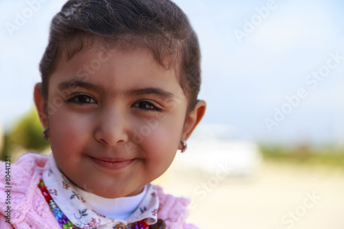Little girl smile with blurry background