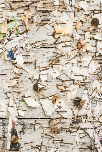 Background texture of weathered and grungy noticeboard