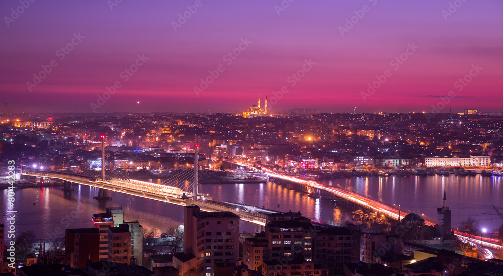 Golden horn at night with mosque skyline in pink