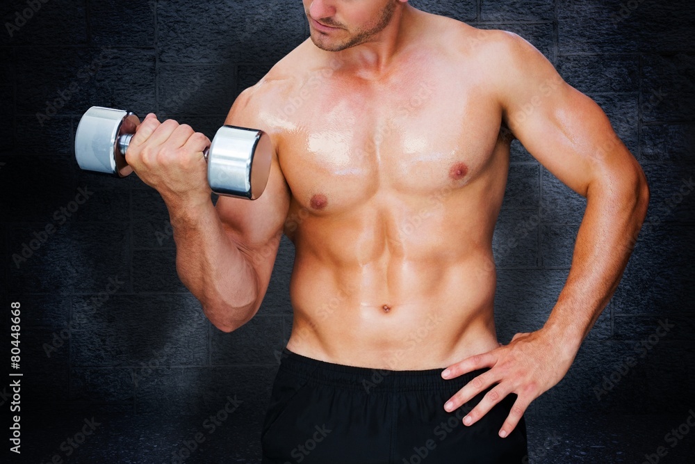 Naklejka premium Composite image of bodybuilder lifting dumbbell
