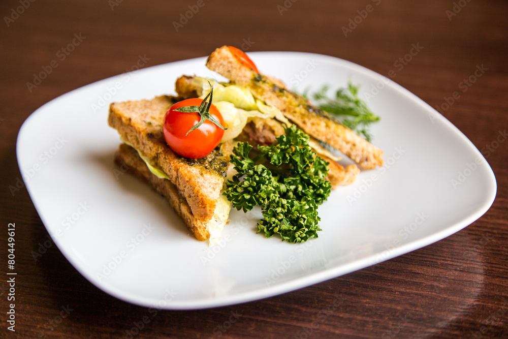 breakfast sandwich on wooden background