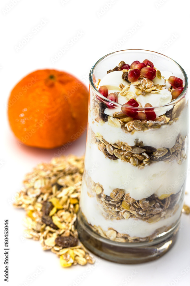 Glass of Muesli with fruits and yogurt isolated on white Glass of Muesli with fruits and yogurt isolated on white