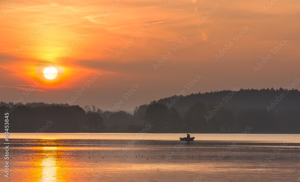 Sunset lake with fisherman boat landscape.