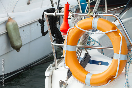 Modern yacht safety equipment, orange lifebuoy