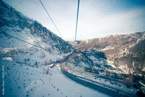 The cable car in the snowy mountains Chimbulak