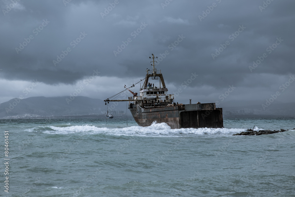 Old ship on the shore, storm