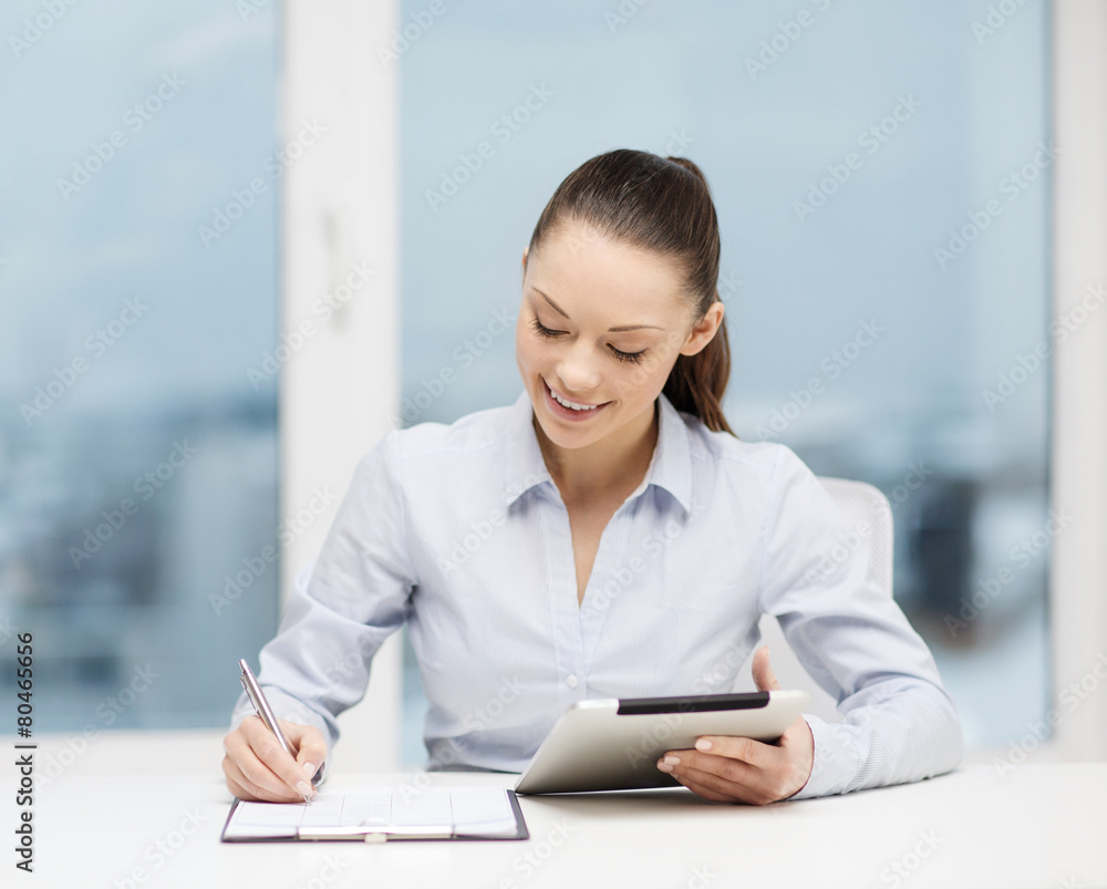 businesswoman with tablet pc and files in office businesswoman with tablet pc and files in office