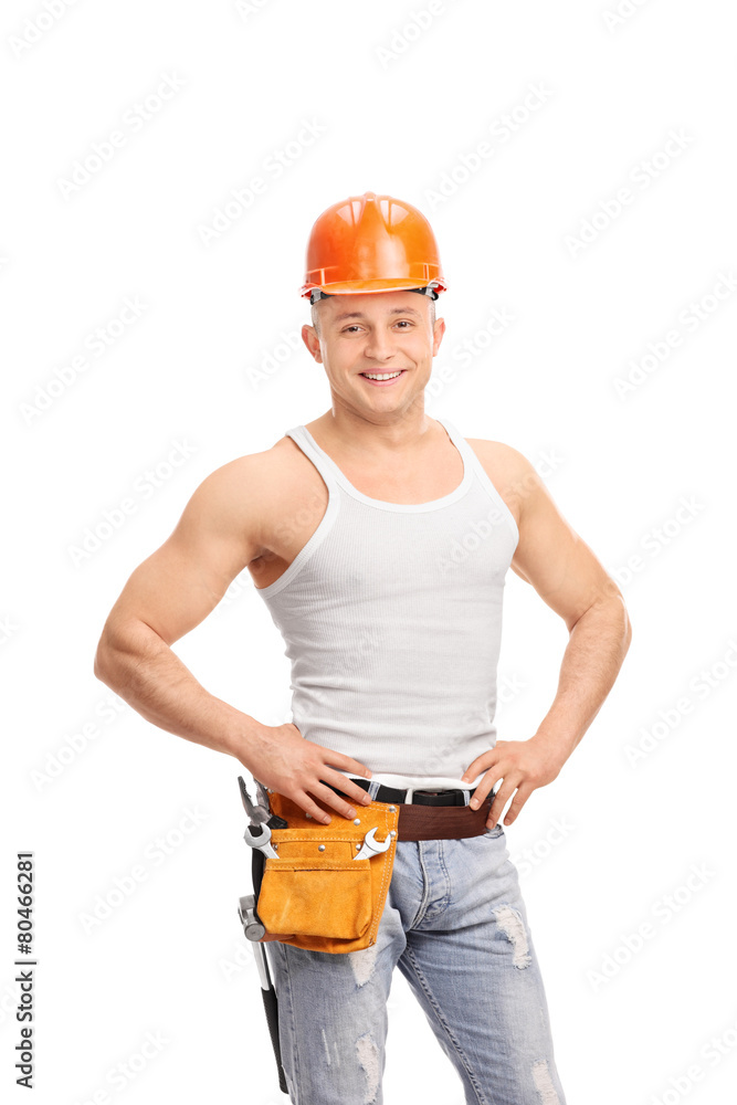 Handsome construction worker with a tool belt Handsome construction worker with a tool belt