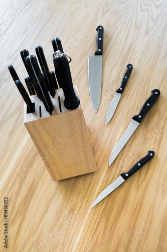 Set of kitchen knife on wooden table