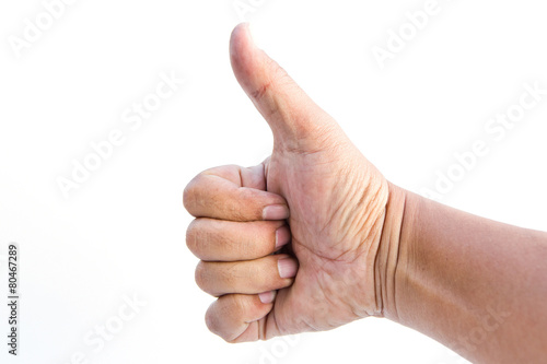 Man hand holding a thumb on a white background.