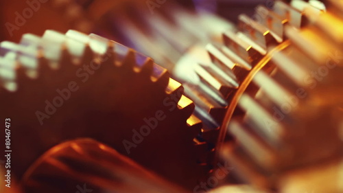 Golden gears with cogs in action. HD 1080p, Loop-ready