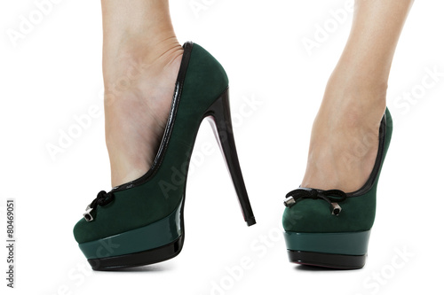 Close up Sexy Flawless Woman Legs in Green High Heel Shoes