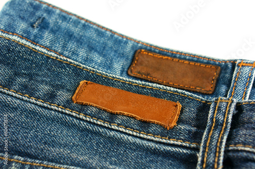 Jeans with leather label isolated on white