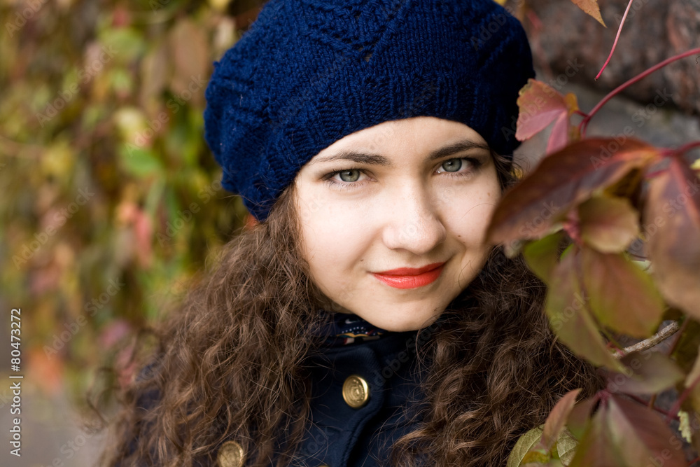 Portrait of young beautiful brunette in blue beret Portrait of young beautiful brunette in blue beret