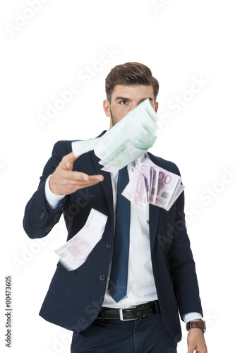 Wealthy successful businessman burning money