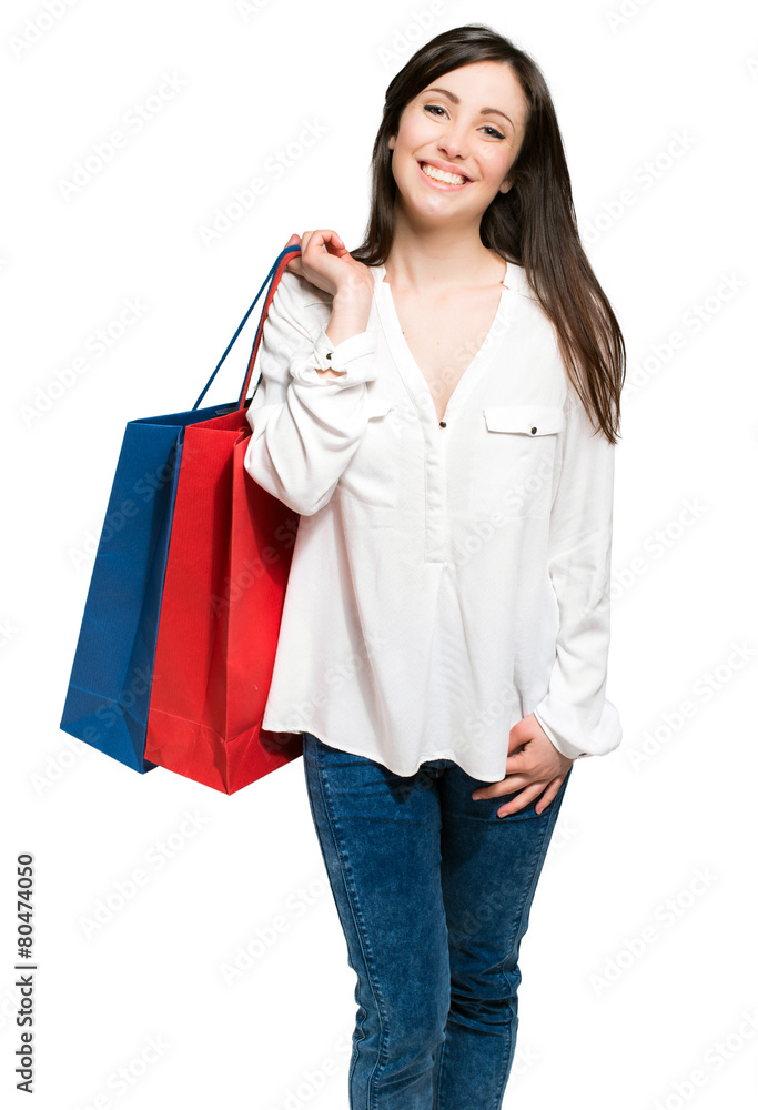 Young woman with shopping bags isolated on white Young woman with shopping bags isolated on white