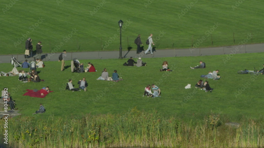 People relaxing in an area of Central Park, New York. People relaxing in an area of Central Park, New York.