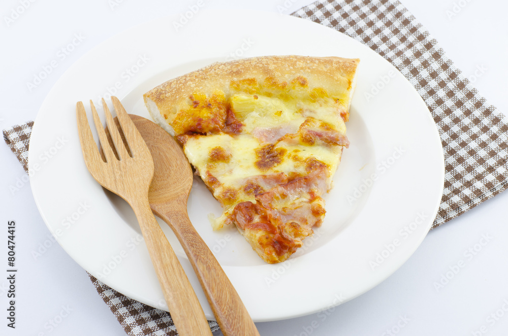 Slice of tasty pizza on the plate with fork