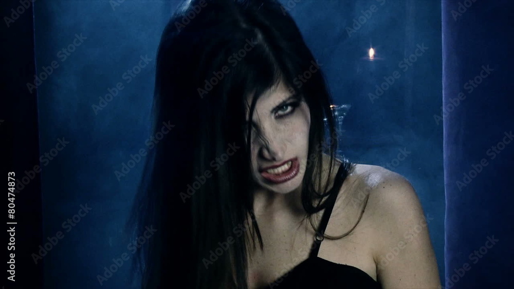 Beautiful angry sensual female vampire medium shot Beautiful angry sensual female vampire medium shot