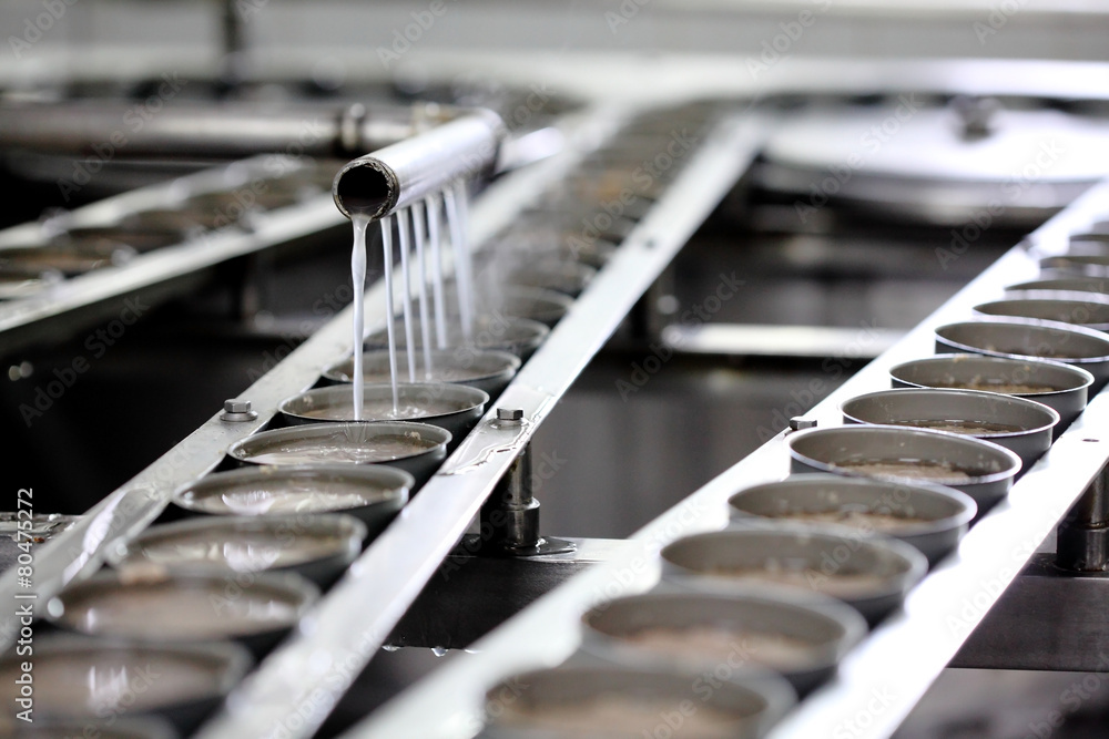 Tuna fish in can processing in factory, manufacturing