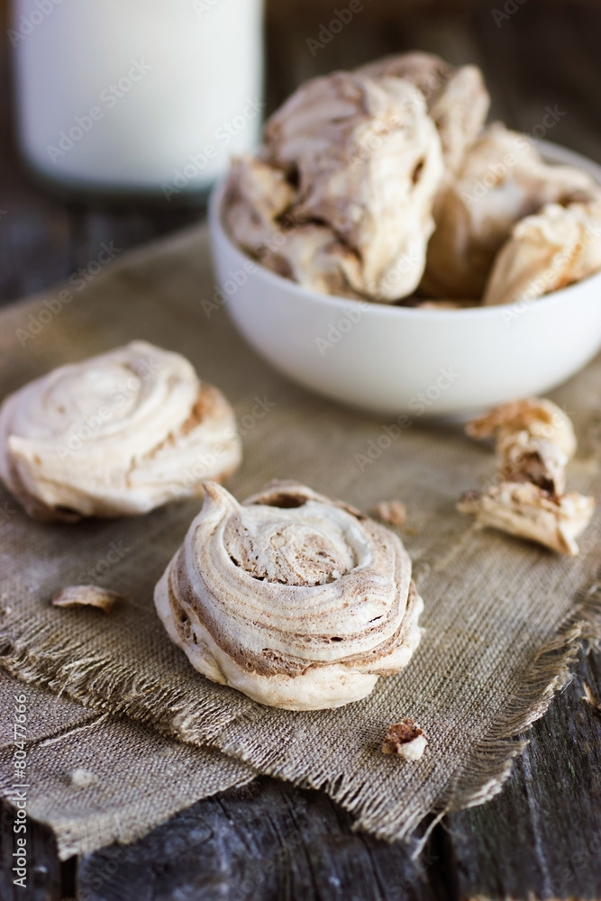 Homemade  meringues with brown chocolate stripes