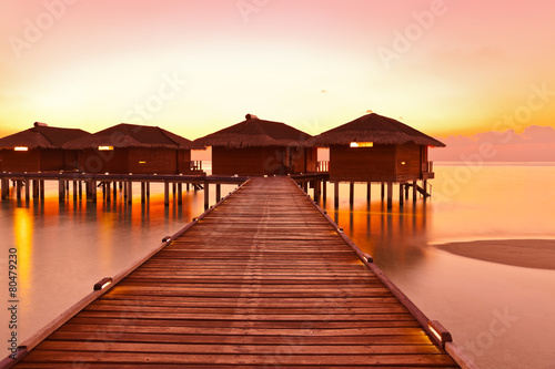 Water bungalows on Maldives island photo