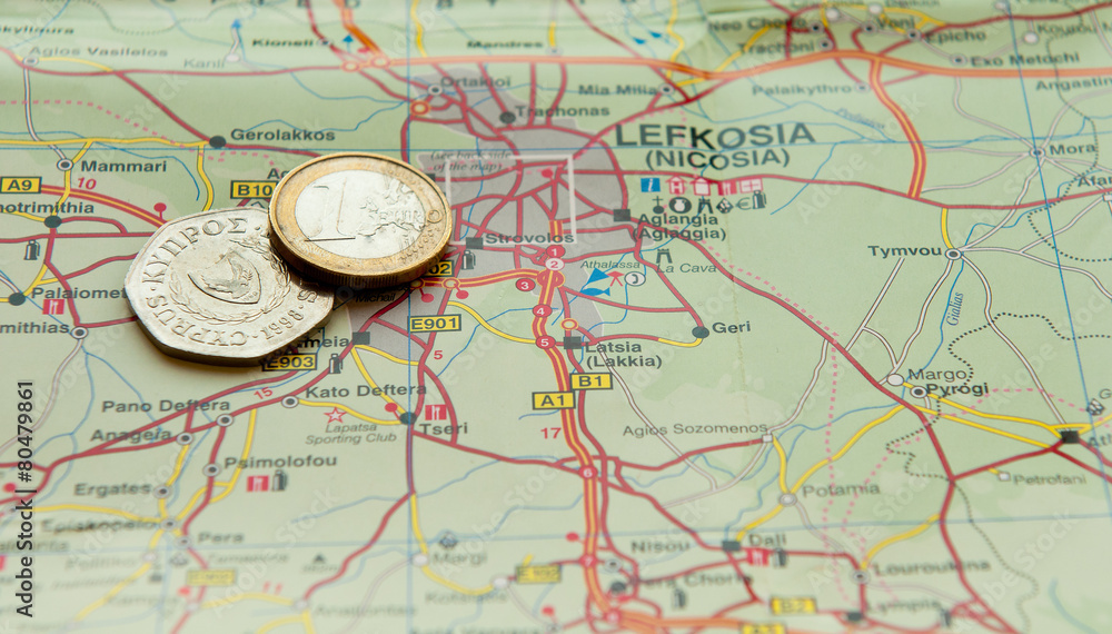 Euro coin and Cyprus cents on a map Euro coin and Cyprus cents on a map