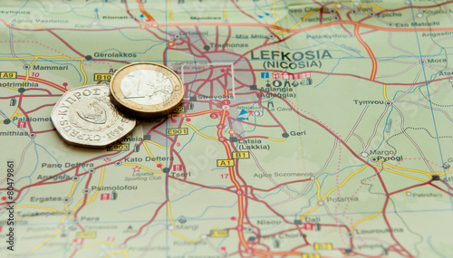 Euro coin and Cyprus cents on a map