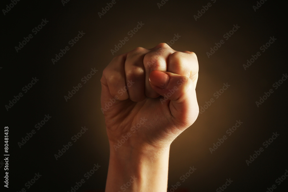Female hand on dark background Female hand on dark background