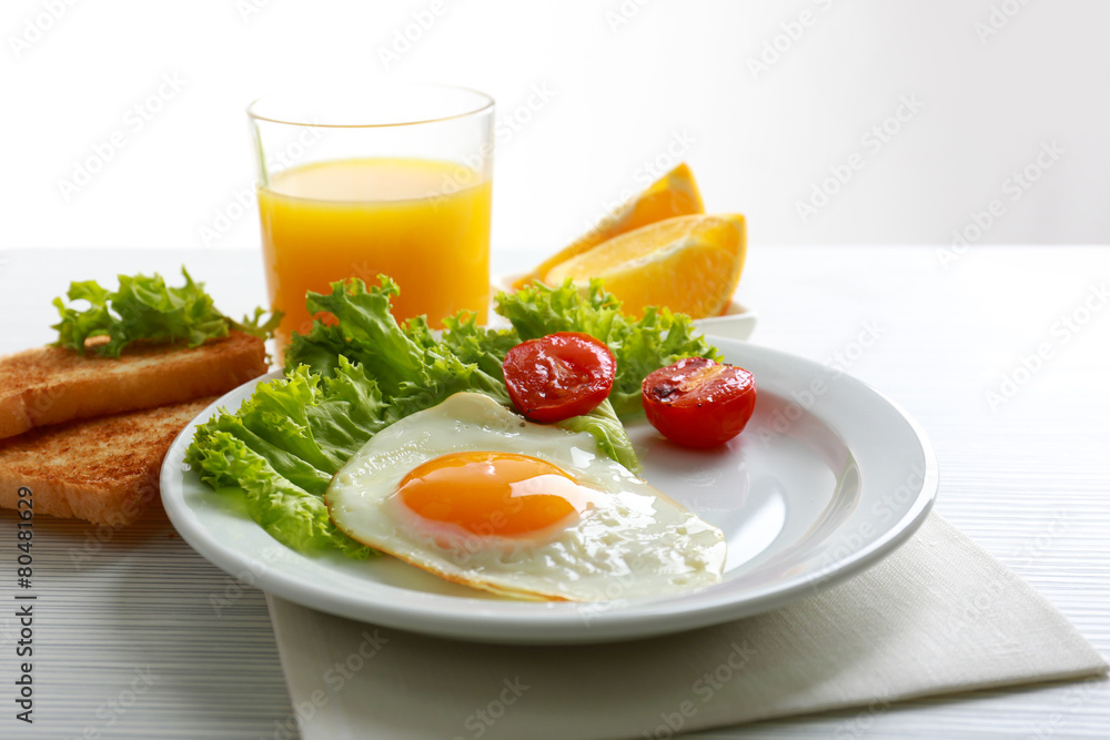 Bacon and eggs on color wooden table background Bacon and eggs on color wooden table background