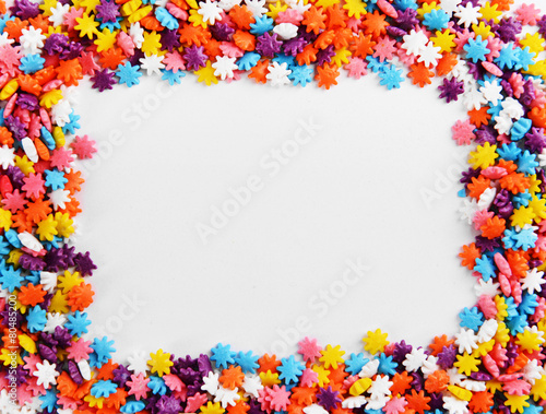 Colorful sprinkles on white background