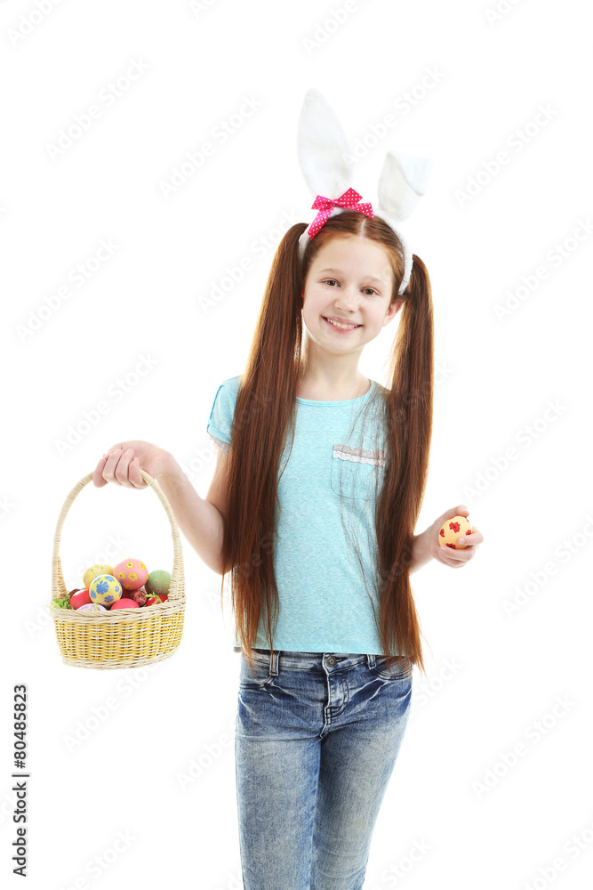 Beautiful little girl wearing Easter bunny ears and holding
