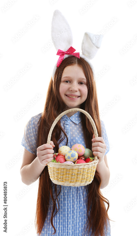 Beautiful little girl wearing Easter bunny ears and holding