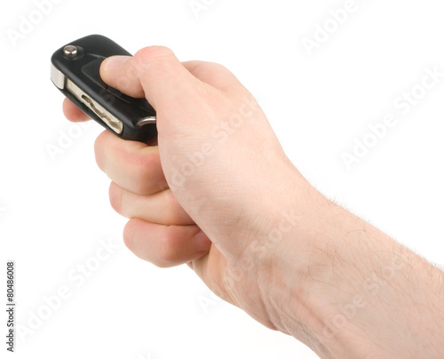 Hand holding car keys isolated on white background