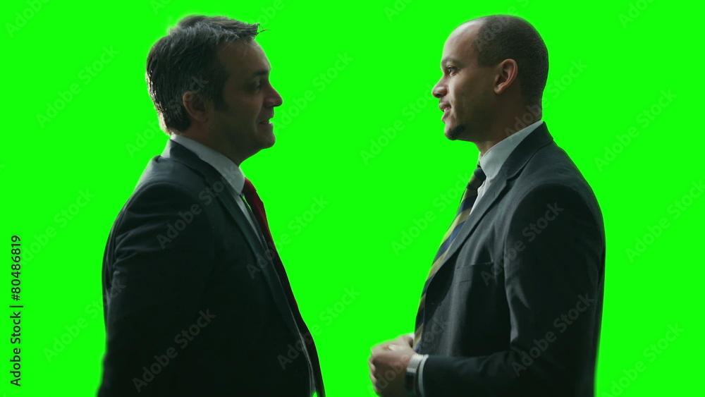 2 businessmen meet and shake hands on green screen background 2 businessmen meet and shake hands on green screen background