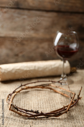 Crown of thorns, scroll and glass of wine