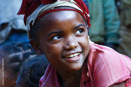 Very pretty malagasy child smiling in the vilage- poverty