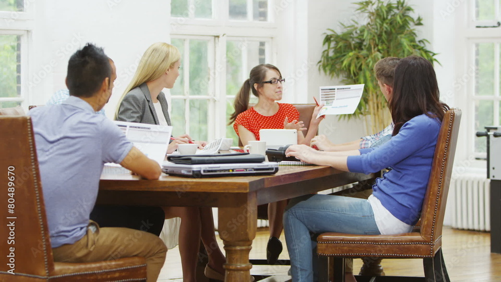 Attractive casual business team in relaxed company meeting Attractive casual business team in relaxed company meeting