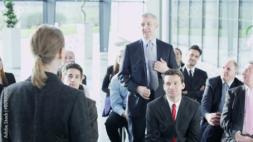 Diverse group of business people attend a business seminar